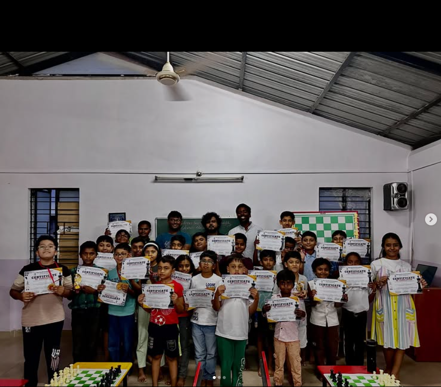 Young Grandmasters Chess Academy students holding certificates